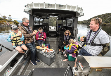 kid fishing family fishing boat children boating lunch